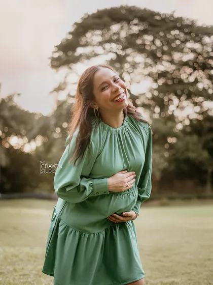 This is the look of pure happiness. During a relaxed outdoor pregnancy photoshoot, I captured her genuine, radiant smile as she soaked in the feeling of this beautiful, fleeting time.