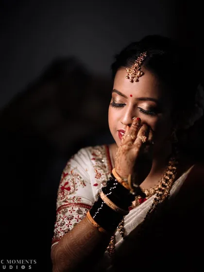An emotional and artistic portrait of the bride. The use of shadow and light creates a powerful, moody image that tells a story.