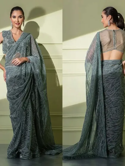 A front and back view of a grey sequined saree with a subtle pattern, paired with a blouse featuring 3D floral details.