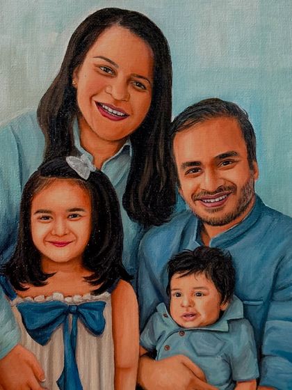 A close-up of the family of four. You can see the detail in their expressions and the soft, blended background that keeps the focus on them.