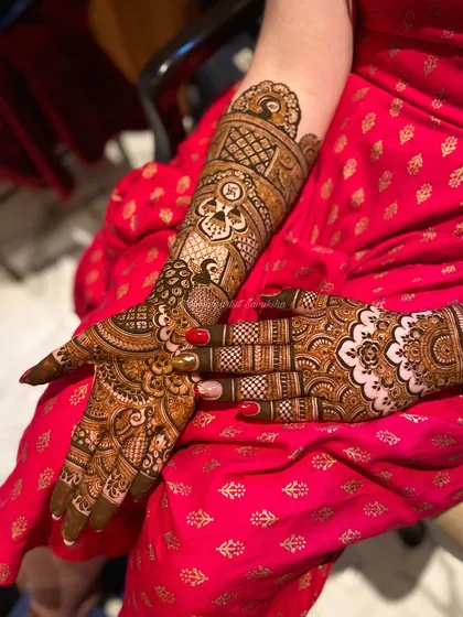 A single arm view of a bridal design, showcasing the intricate peacock and grid patterns that are perfect for a wedding.