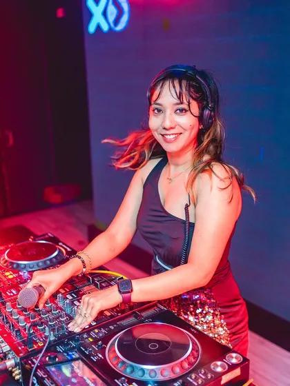 A smile on my face and my hands on the Pioneer decks. This is me in my element, ready to mix the perfect set of Punjabi and Bollywood tracks for a club night.