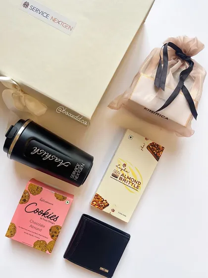 A flat-lay of the items from the Service Nextgen birthday box, showcasing the quality and variety of products we curate for employee appreciation gifts.