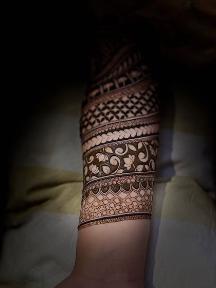 A full-sleeve design with spiraling bands of different patterns, creating a unique and dynamic look.