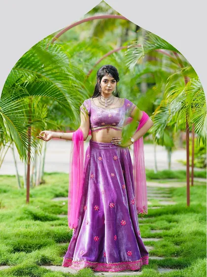 Modern royalty in a lilac velvet lehenga. This ensemble is designed for a grand reception or cocktail evening, featuring delicate appliqué zardosi embroidery. The rich velvet fabric and contemporary silhouette offer a perfect blend of tradition and modern luxury.