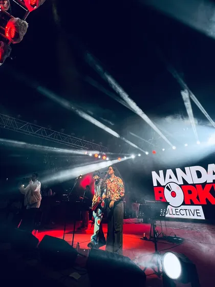 The band and I on stage, surrounded by stage smoke and dramatic lighting. This captures the rockstar energy we bring to our pop and rock sets.