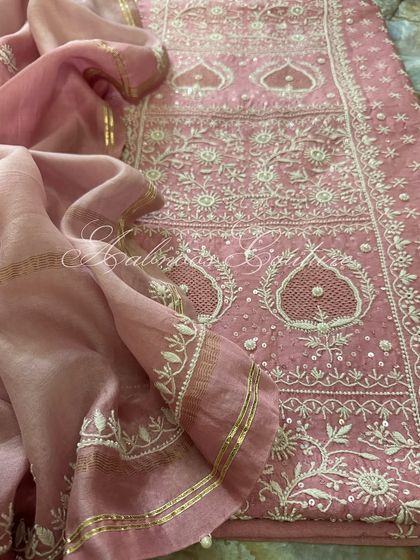 A close-up showing the drape of the ombré dupatta against the heavily worked kurta.