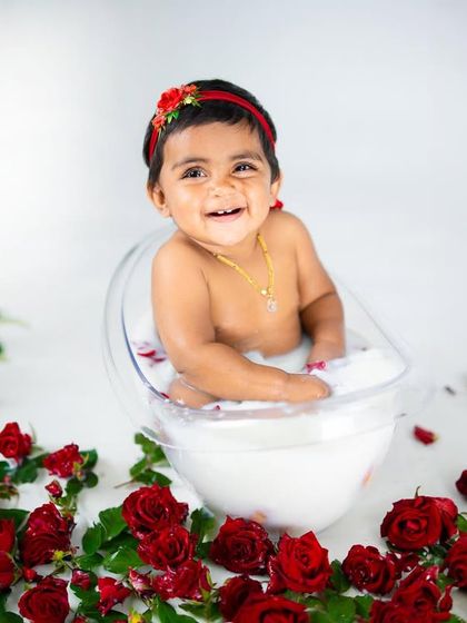 A luxurious milk bath session with red roses. This is a unique and beautiful way to capture your toddler, resulting in stunning, artistic portraits.