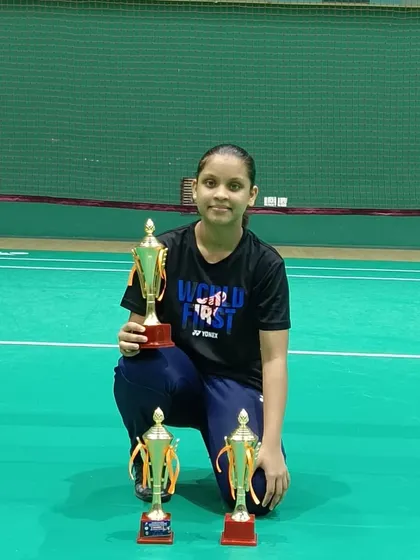 Saanvi Audi with her triple crown trophies from the All Goa state ranking tournament, winning U15 singles, doubles, and mixed doubles.