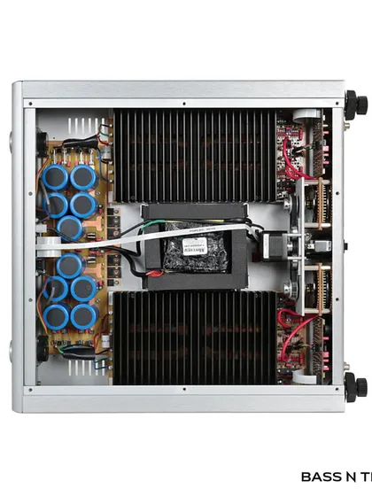 A look inside the Ayre AX-5 reveals the meticulous, fully-balanced, zero-feedback circuitry. The layout, including the Double Diamond output stage and large transformer, is engineered for one thing: the purest possible sound.