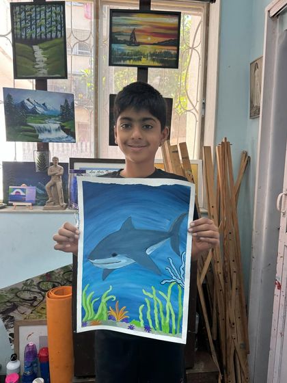 An underwater adventure. This student created a wonderful painting of a shark, learning how to blend colours to create the effect of light filtering through water.