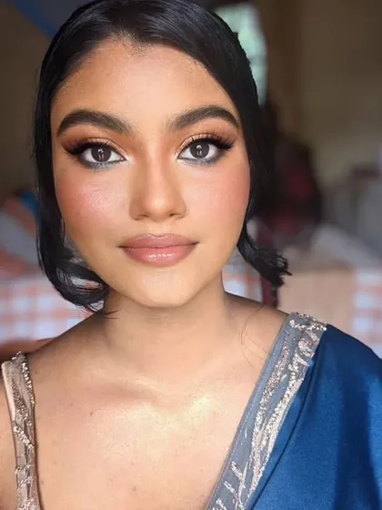 The final look is pure radiance. This soft glam makeup is perfect for a party or wedding guest, providing a flawless yet natural finish.