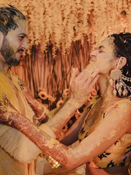 An intimate moment amidst the Haldi fun. Even with all the energy, I ensure there are opportunities for the couple to share quiet, romantic glances.