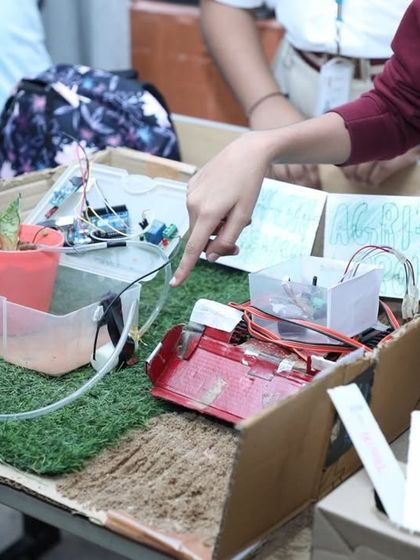 This project is an automated plant watering system, designed and built by a student in our Pro-Innovator category. It uses sensors to detect soil moisture and water the plant automatically, a great example of solving a real-world problem with robotics.