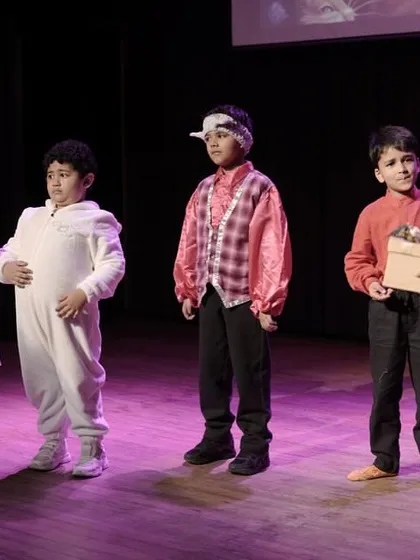 A scene featuring multiple characters from one of our fairy tale productions. This demonstrates how children learn to share the stage and interact within a group narrative.