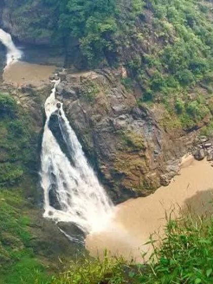 Magodu Falls, one of the highlights of our Yallapura exploration trip, seen from a distance as it cascades down the rocky cliffs.