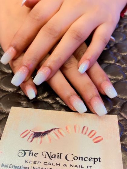 A clean and classic baby boomer ombre on coffin-shaped nails. The subtle glitter in the white tips adds a touch of sparkle to this timeless design.