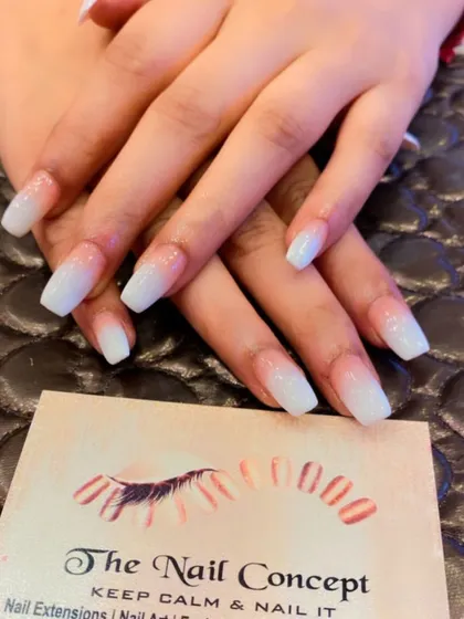 A clean and classic baby boomer ombre on coffin-shaped nails. The subtle glitter in the white tips adds a touch of sparkle to this timeless design.