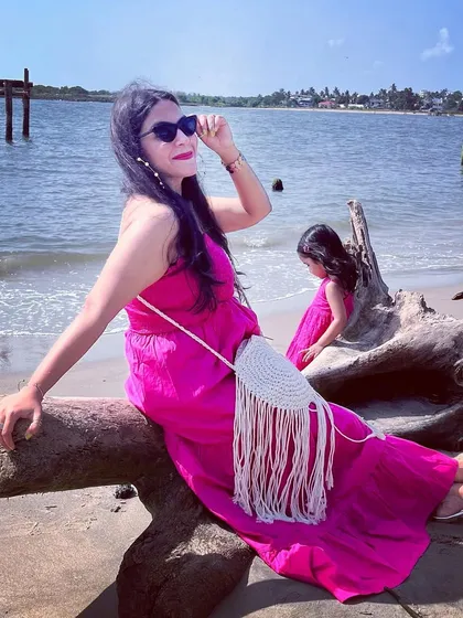 She and the sea. A beautiful moment with my daughter on a beach in Kochi, both of us in shades of pink. My flowy maxi dress was perfect for the beach.