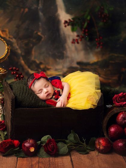 My very own little Snow White. Themed newborn shoots are so much fun, and this one with the iconic red apple and woodland backdrop is a fairytale come to life.