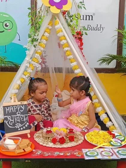 Our beautifully decorated Rakhi corner was the perfect spot for children to celebrate. Here, they are seen sharing sweets and tying rakhis in a cozy, festive tent.