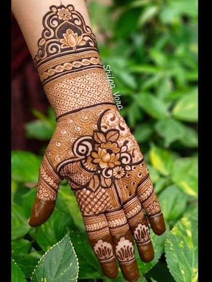 A gorgeous floral design with a large lotus as the centerpiece, surrounded by intricate patterns.