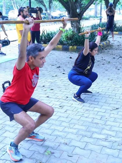 Overhead squats with bamboo sticks to improve mobility and form. We focus on fundamental movement patterns before adding heavy loads.