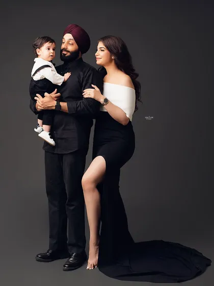 Family portraits can be cool too. I love the coordinated black and white outfits this family chose for their studio session. It creates a modern, chic look that's full of personality, especially with their little one stealing the show.