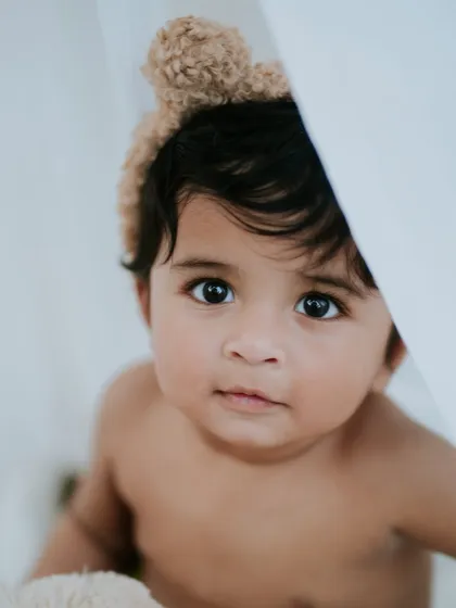 Those big, beautiful eyes. This close-up portrait of a nine-month-old is simple, soulful, and absolutely captivating.