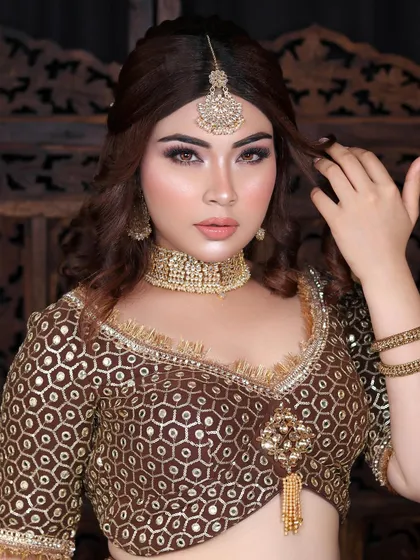 A confident pose showing the complete engagement look, from the beautiful makeup and hair to the intricate outfit.