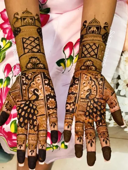 A classic for a reason. This full bridal mehendi features majestic peacocks and intricate patterns, covering both hands symmetrically for a truly royal look on your wedding day.