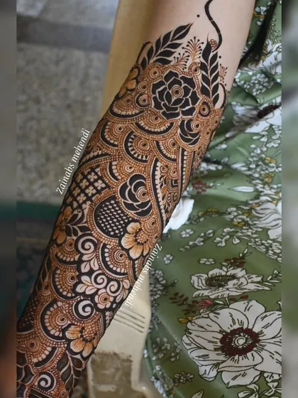 A beautiful bridal forearm design for Asba, featuring a mix of roses and other floral elements.