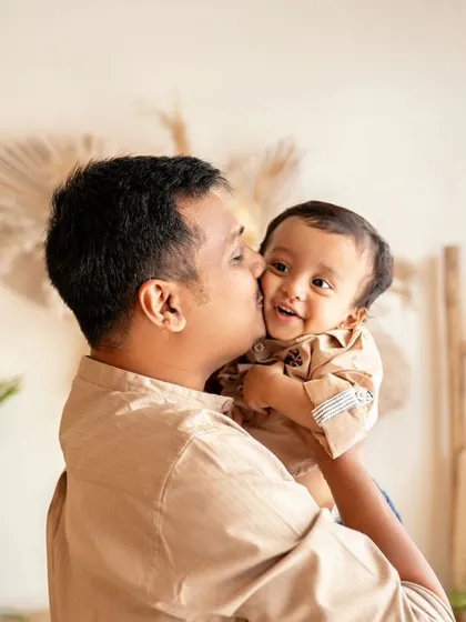 A father's gentle kiss for his son. These are the moments that fathers will cherish forever.