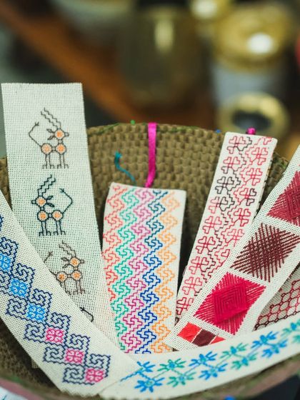 A basket full of colorful, hand-embroidered bookmarks. Each one is a small piece of art, perfect as a gift or a treat for yourself. These were created for an exhibition and sale.
