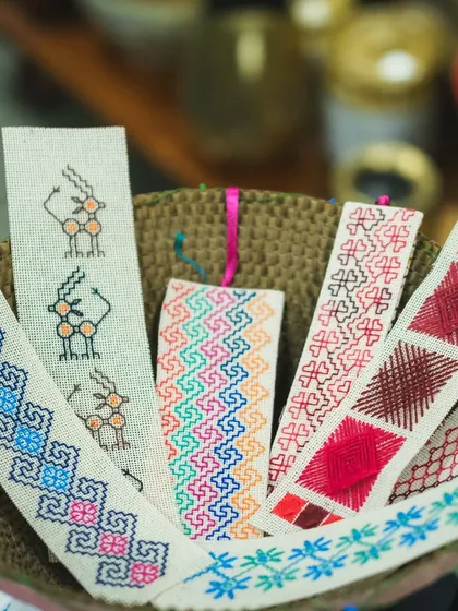 A basket full of colorful, hand-embroidered bookmarks. Each one is a small piece of art, perfect as a gift or a treat for yourself. These were created for an exhibition and sale.