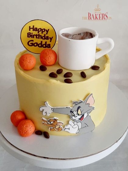 This cake was designed for Godda, who loves to spend his Sundays with coffee, motichoor laddoos, and watching Tom & Jerry. I combined all his favorite things into one fun, personalized cake.