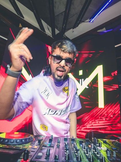 Posing for the camera while mixing at Flo. I'm always having as much fun as the crowd, and I think that energy is contagious.