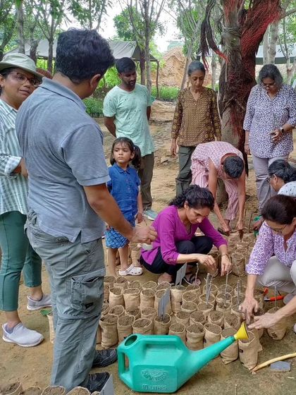 Participants learn to plant grass slips in eco-friendly jute bags, a key skill for restoring grassland habitats.