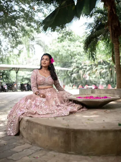 A beautiful shot of the model in a garden. The natural light and her serene expression create a peaceful and elegant image.