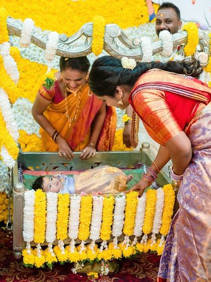 The cradle ceremony is a beautiful tradition. I capture the moment the baby is placed in the cradle, surrounded by smiling family members.