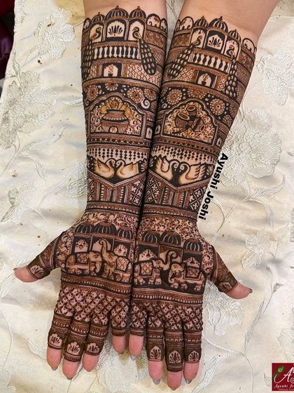A full bridal mehendi packed with traditional motifs like palaces, swans, elephants, and kalash, but without any human figures for a classic, timeless look.