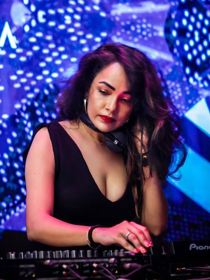 A fellow DJ in her element at one of my events. I support and feature other talented artists, ensuring a diverse and quality musical experience.