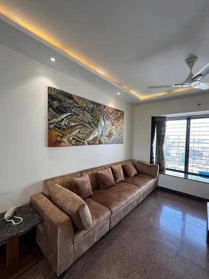 This wide shot shows how the large fibre mural fits perfectly in this modern living room, adding a layer of sophisticated, custom art.