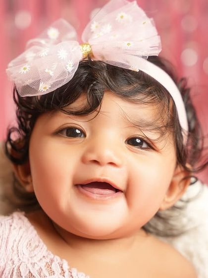 The most radiant smile from our six-month-old Barbie. This close-up captures her happy spirit and sparkling eyes.