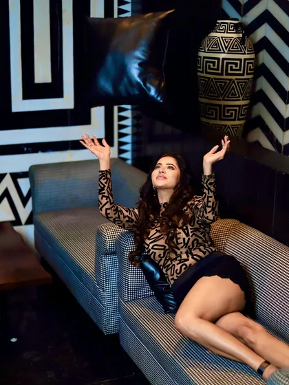 A playful and candid moment from the photoshoot. The makeup looks just as good in spontaneous shots as it does in posed ones.