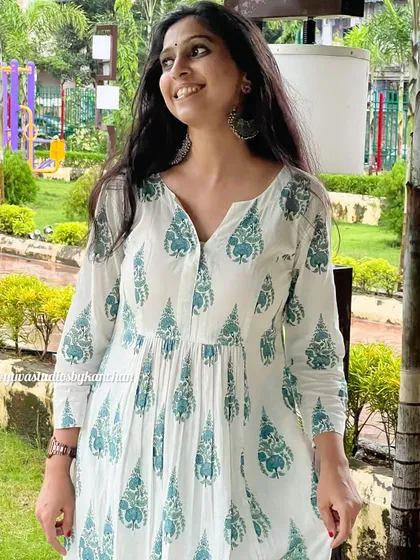 This white and green printed kurta-pant set is perfect for any occasion. It ensures you stand out with timeless style and grace.