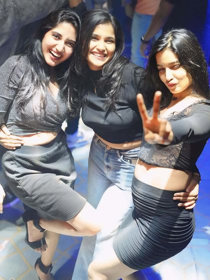 Friends having a fun, playful moment on the dance floor. I create an atmosphere where everyone feels comfortable letting loose and being themselves.