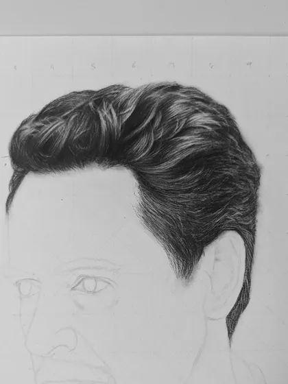 A work-in-progress shot of my Robert Downey Jr. portrait. Here, I have focused on rendering the hair with incredible detail, showing how I use a sharp pencil and the grid method to ensure accuracy and realism.