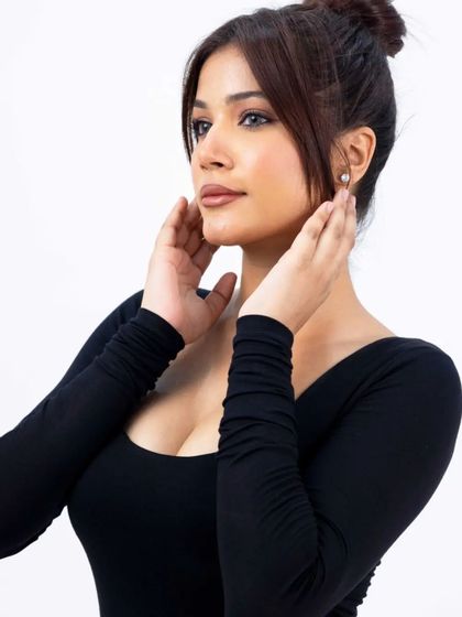 A beauty-focused close-up from an e-commerce shoot. While the main goal is to sell the dress, this shot also highlights the neckline and can be used for social media or beauty features.