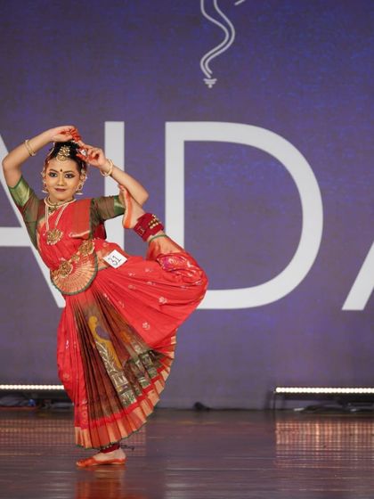 An advanced pose requiring immense flexibility and balance. This student's incredible skill won her a 2nd place award in the senior category.